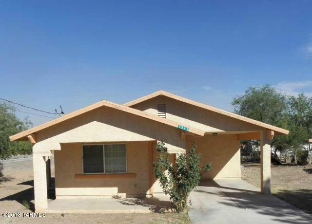 1241 Calle Pico Rio Rico, AZ 85648 - Photo 1 of 9 a front view of a house with a garage