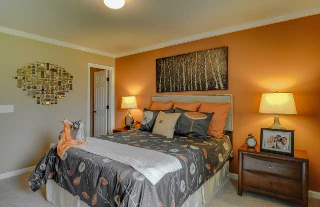 1419 Old Stone Road, Unit 704 Lebanon, TN 37087 - Photo 13 of 22 a bedroom with a bed and a lamp on dresser