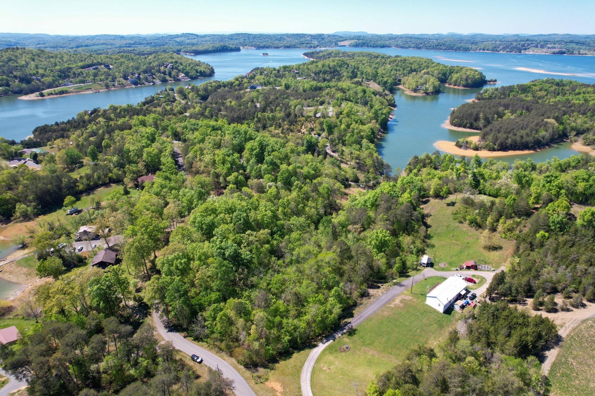 13 Pleasure Road Sevierville, TN 37876 - Photo 4 of 20 an aerial view of green landscape with trees houses and mountain view