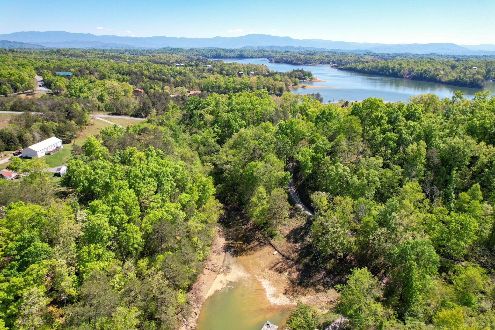 13 Pleasure Road Sevierville, TN 37876 - Photo 7 of 20 a view of a lake with houses in the back