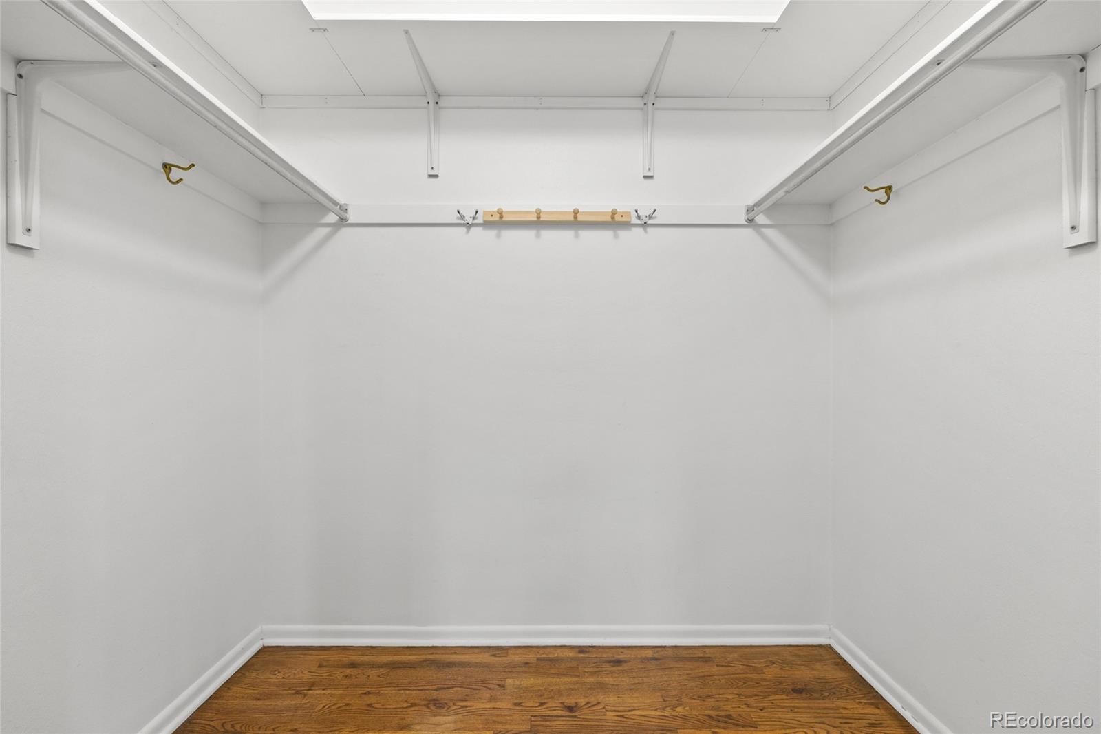 1131 Birdie Road Broomfield, CO 80020 - Photo 16 of 43 a view of a room with racks on the wall