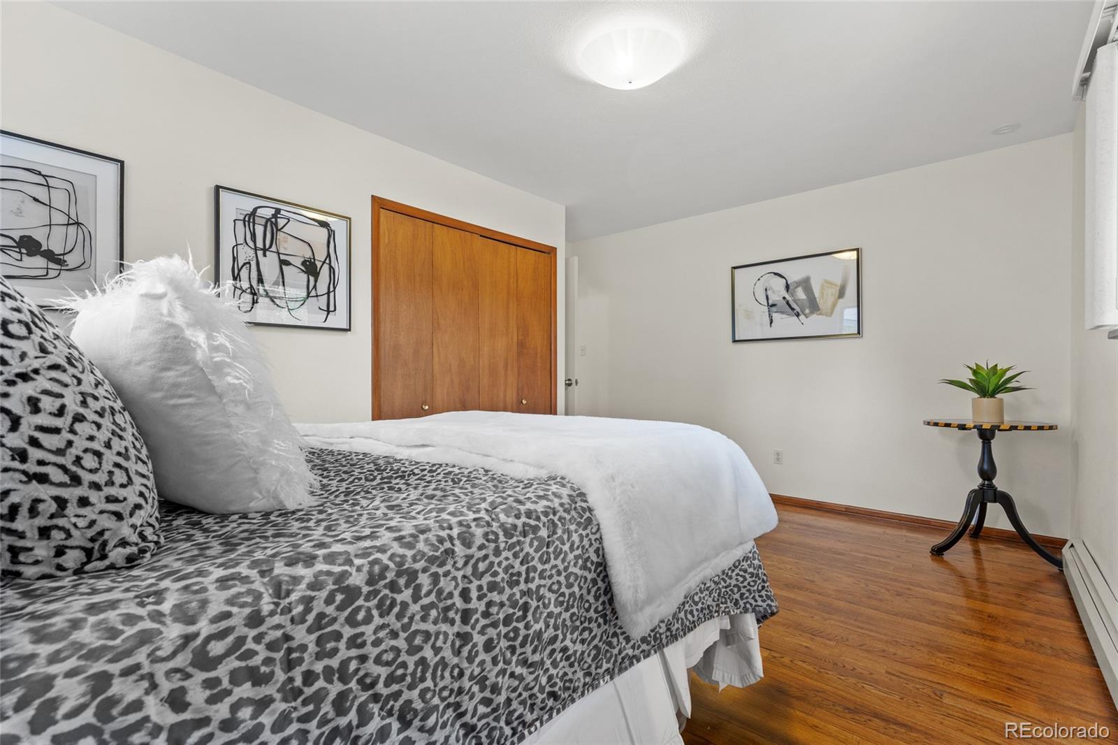 1131 Birdie Road Broomfield, CO 80020 - Photo 20 of 43 a bedroom with a bed and a table