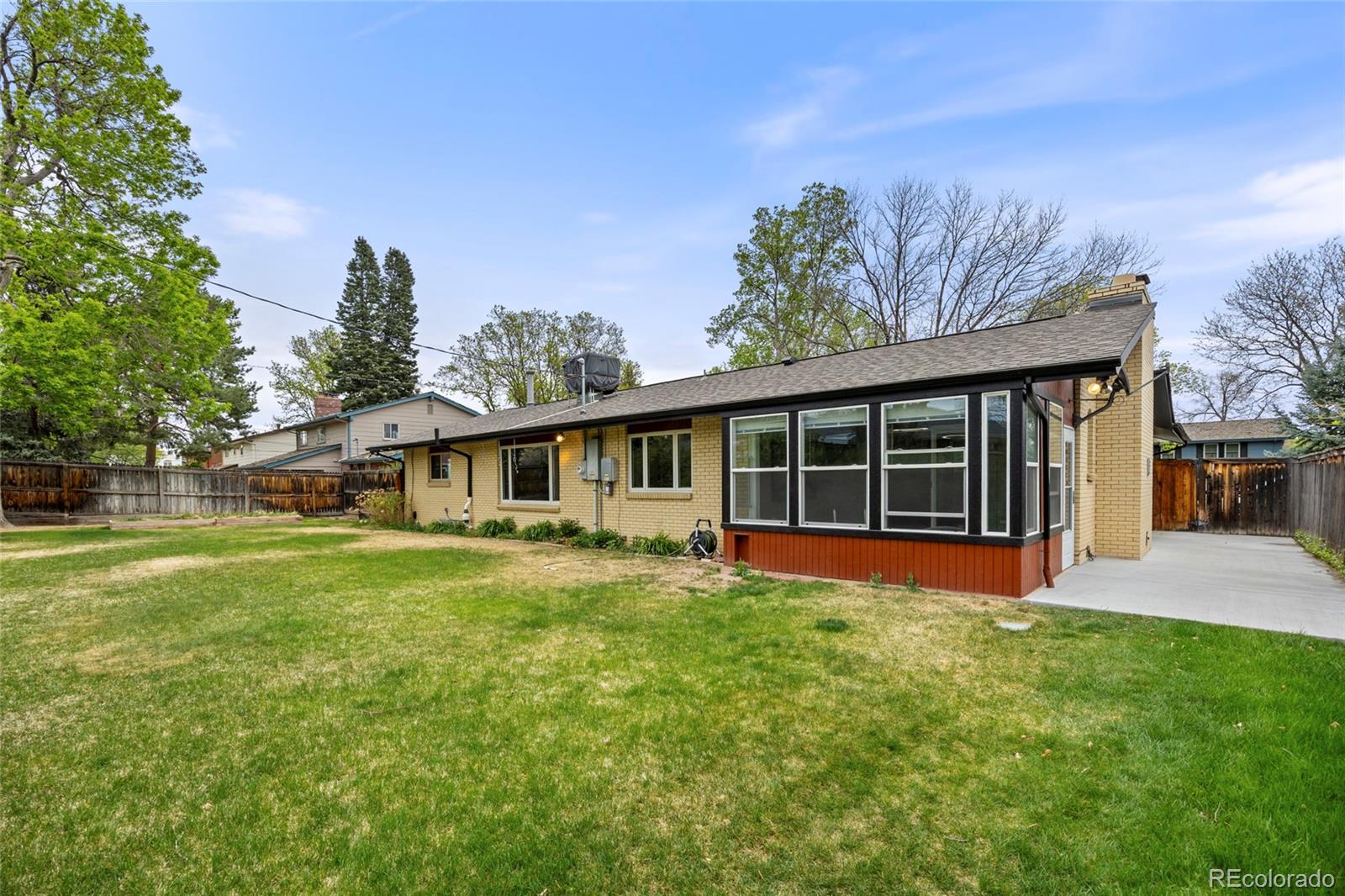 1131 Birdie Road Broomfield, CO 80020 - Photo 34 of 43 a front view of a house with a yard and trees