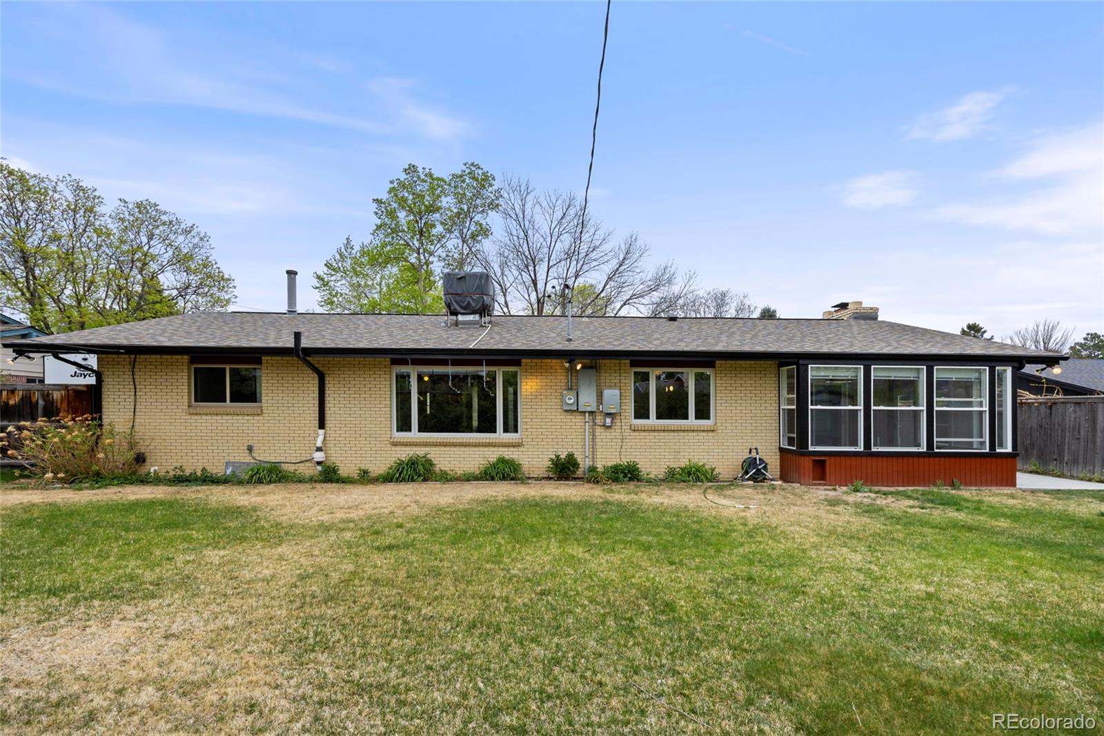 1131 Birdie Road Broomfield, CO 80020 - Photo 35 of 43 a front view of a house with yard and trees