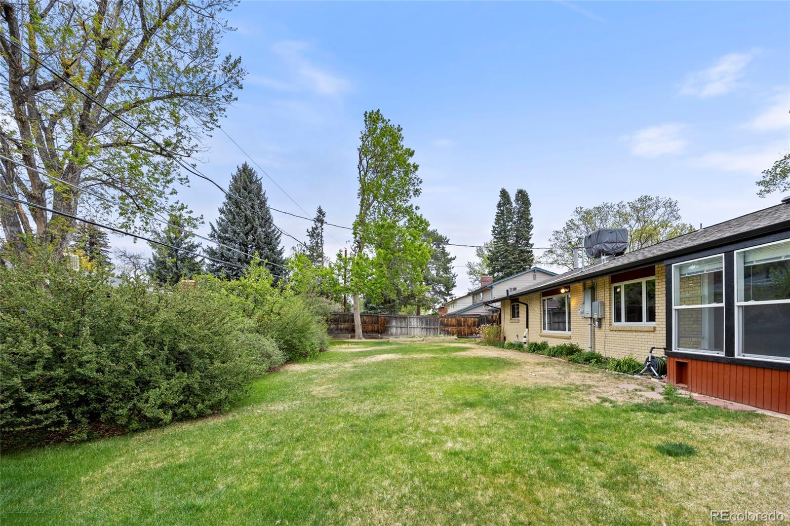 1131 Birdie Road Broomfield, CO 80020 - Photo 40 of 43 a front view of a house with a yard and trees
