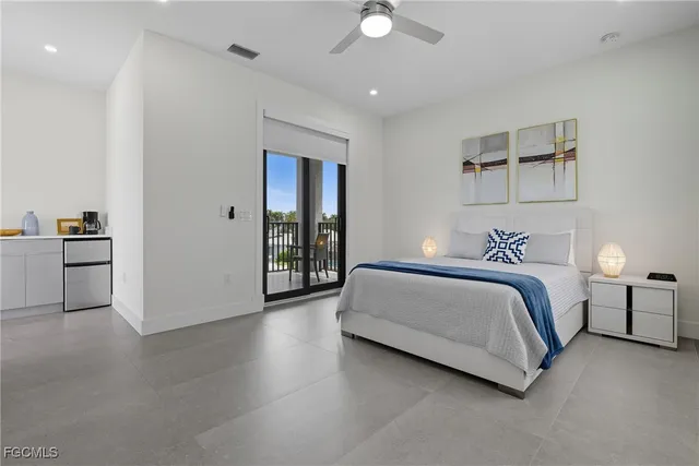 a bedroom with a bed and a view of bathroom