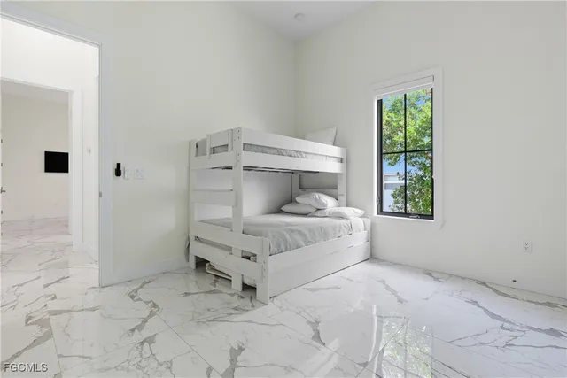 a bathroom with a sink mirror vanity and toilet