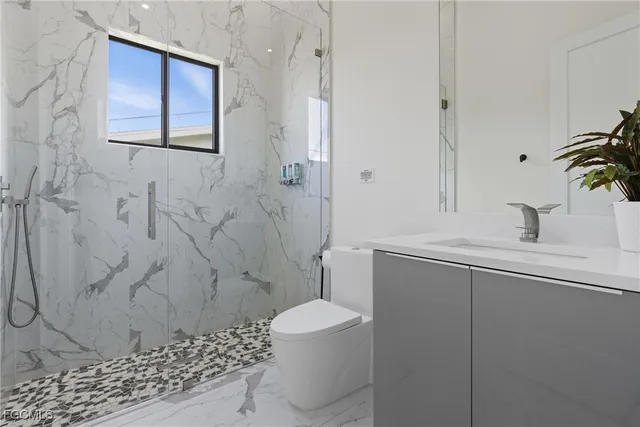 a spacious bedroom with a bed and a window