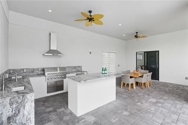 a view of a balcony with wooden floor & fence
