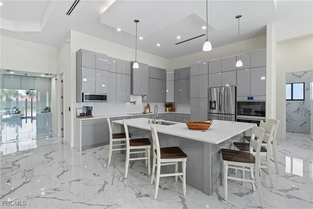 a bathroom with a glass shower door and a sink