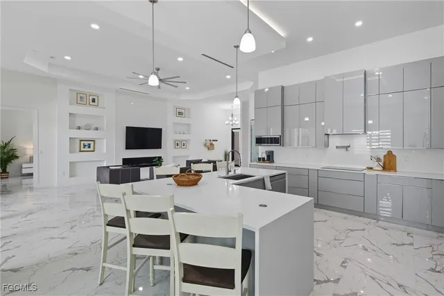 a large kitchen with a table and chairs
