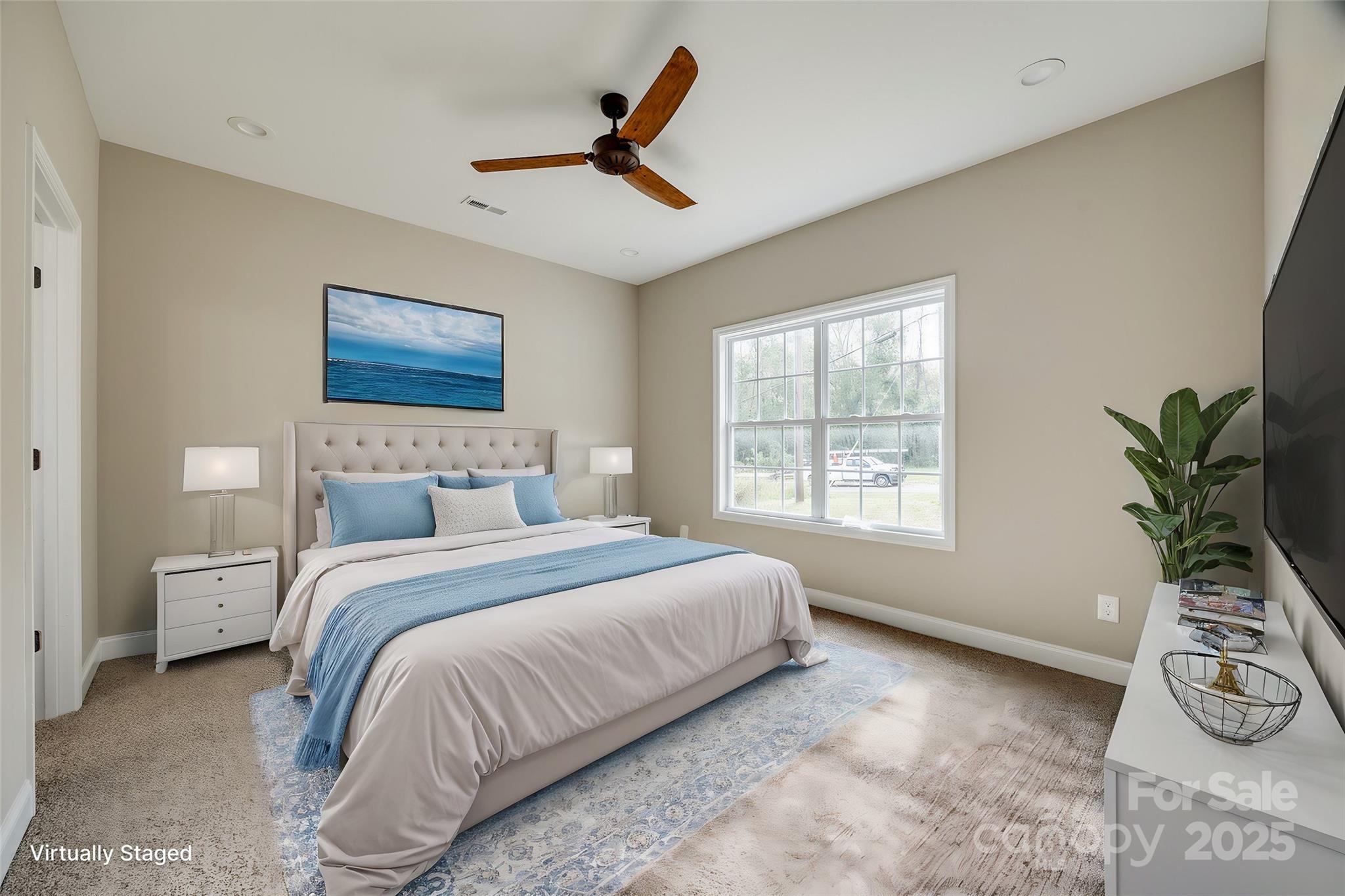 1960 Powell Avenue Lancaster, SC 29720 - Photo 5 of 13 a bedroom with a bed a chandelier and a window