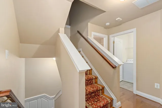 a view of a livingroom with a ceiling fan and window
