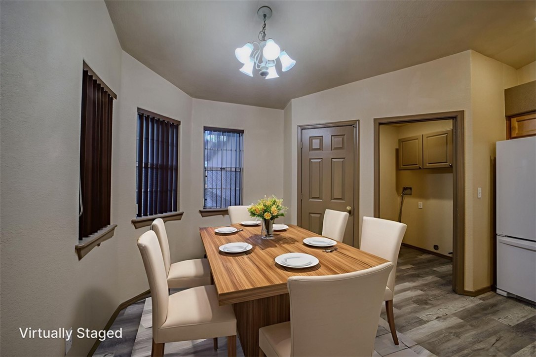 2213 Jamie Road Fort Mohave, AZ 86426 - Photo 13 of 51 Dining area with wood finished floors and a chandelier