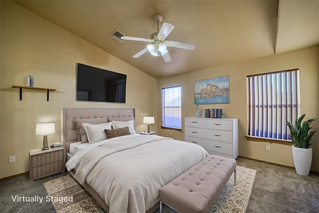 2213 Jamie Road Fort Mohave, AZ 86426 - Photo 14 of 51 Bedroom with lofted ceiling, carpet, and a ceiling fan