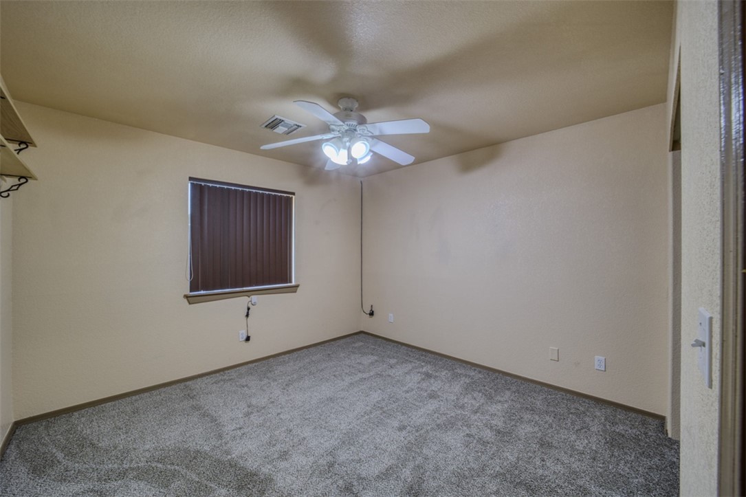 2213 Jamie Road Fort Mohave, AZ 86426 - Photo 18 of 51 Unfurnished bedroom featuring a ceiling fan and carpet