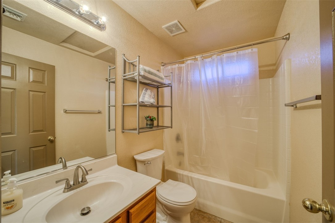 2213 Jamie Road Fort Mohave, AZ 86426 - Photo 22 of 51 Full bath with shower / bathtub combination with curtain, vanity, and tile patterned flooring