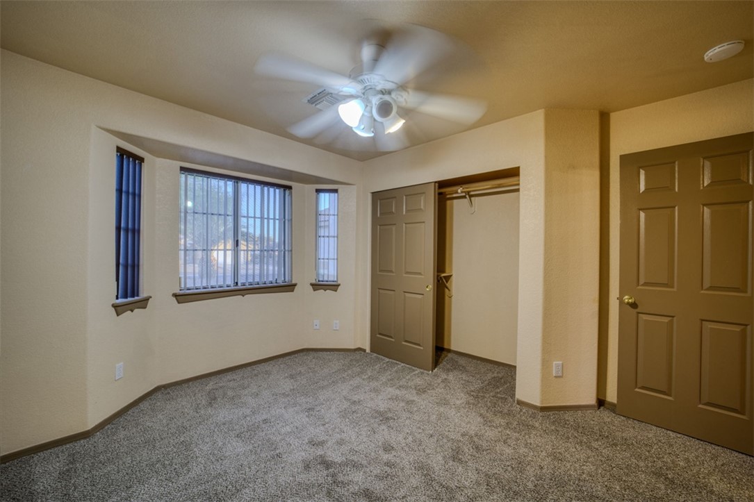 2213 Jamie Road Fort Mohave, AZ 86426 - Photo 24 of 51 Unfurnished bedroom with a closet, carpet, and a ceiling fan