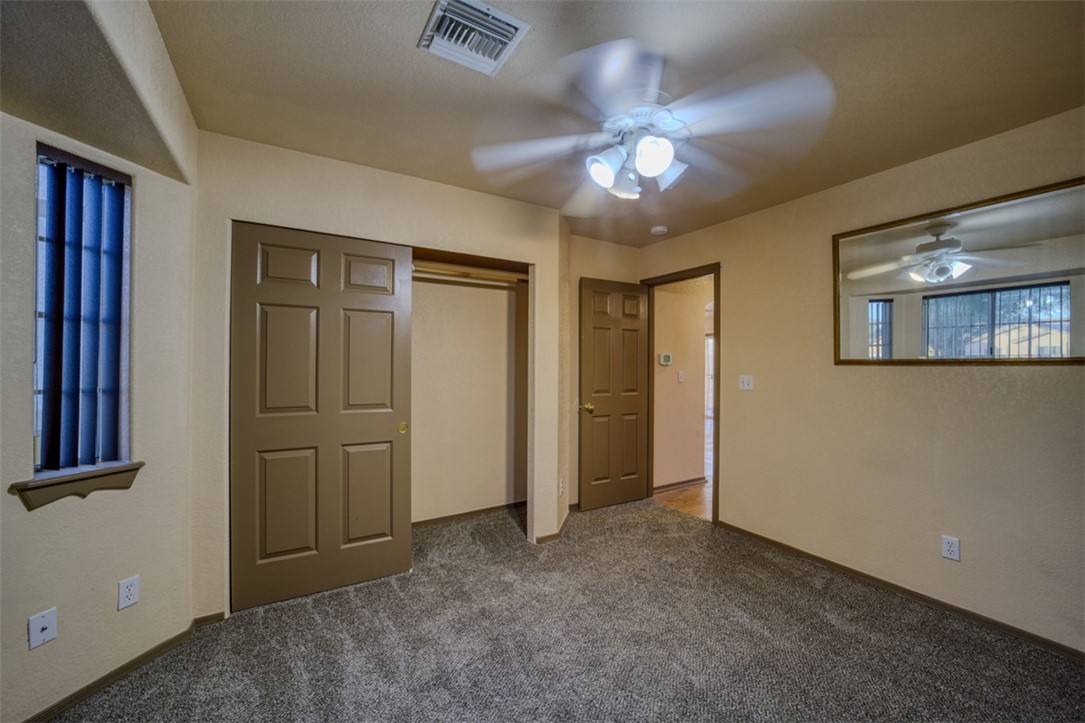 2213 Jamie Road Fort Mohave, AZ 86426 - Photo 26 of 51 Unfurnished bedroom featuring carpet floors, a closet, and ceiling fan