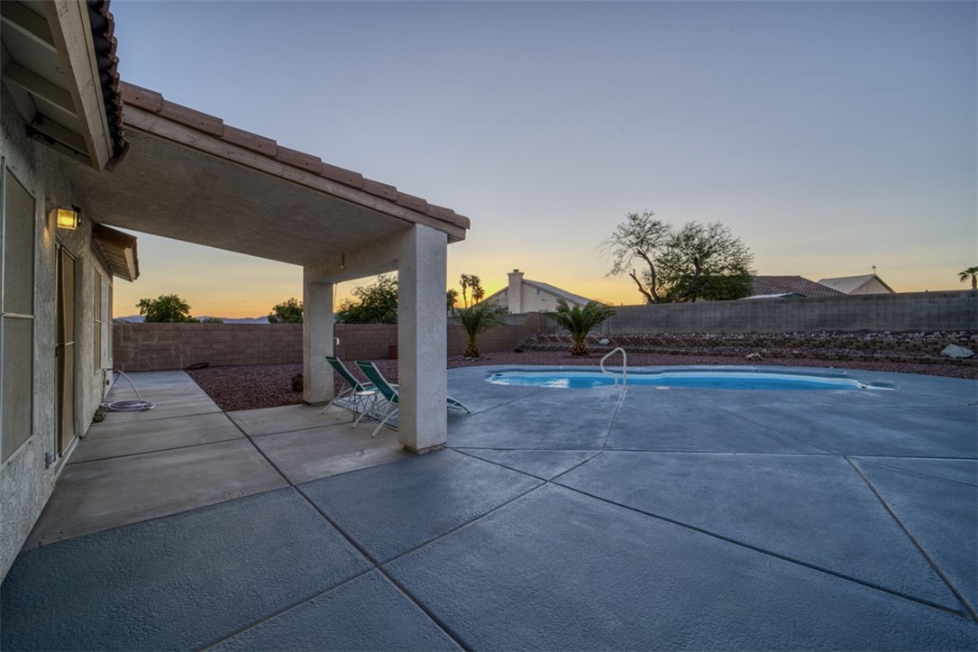 2213 Jamie Road Fort Mohave, AZ 86426 - Photo 30 of 51 View of swimming pool featuring a patio area and a fenced backyard
