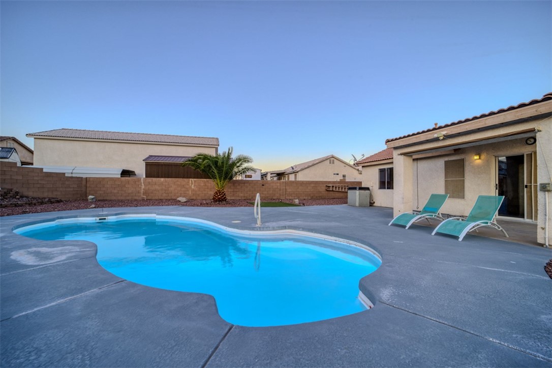 2213 Jamie Road Fort Mohave, AZ 86426 - Photo 37 of 51 View of swimming pool featuring a fenced backyard and a patio