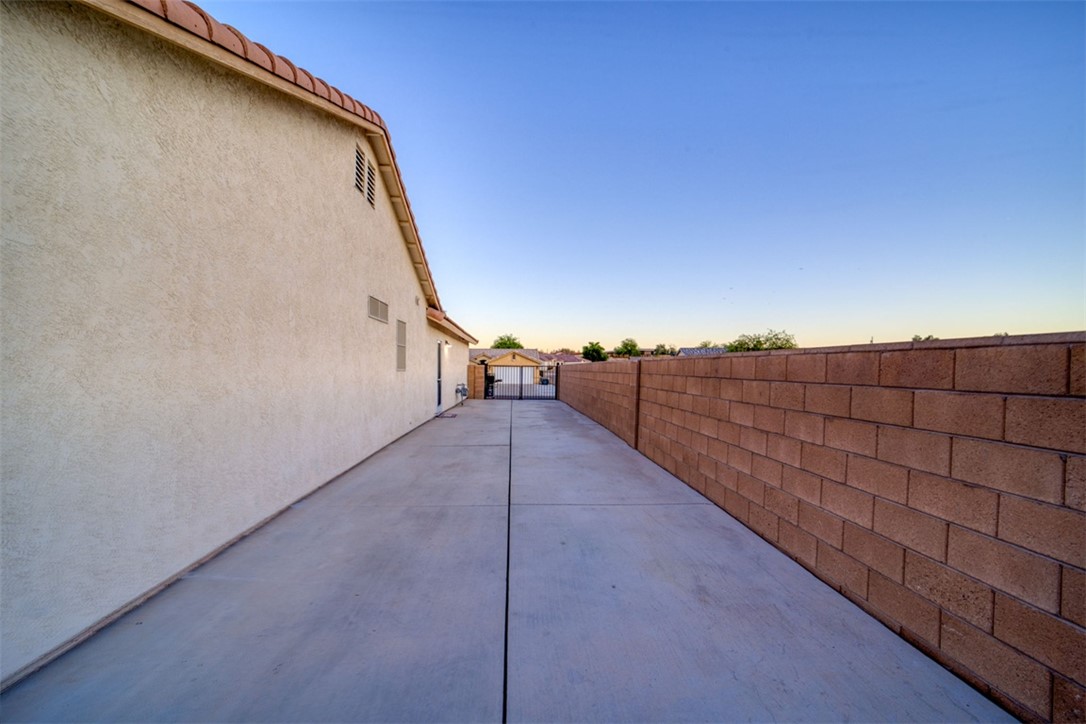2213 Jamie Road Fort Mohave, AZ 86426 - Photo 38 of 51 Patio terrace at dusk featuring a fenced backyard and a patio area