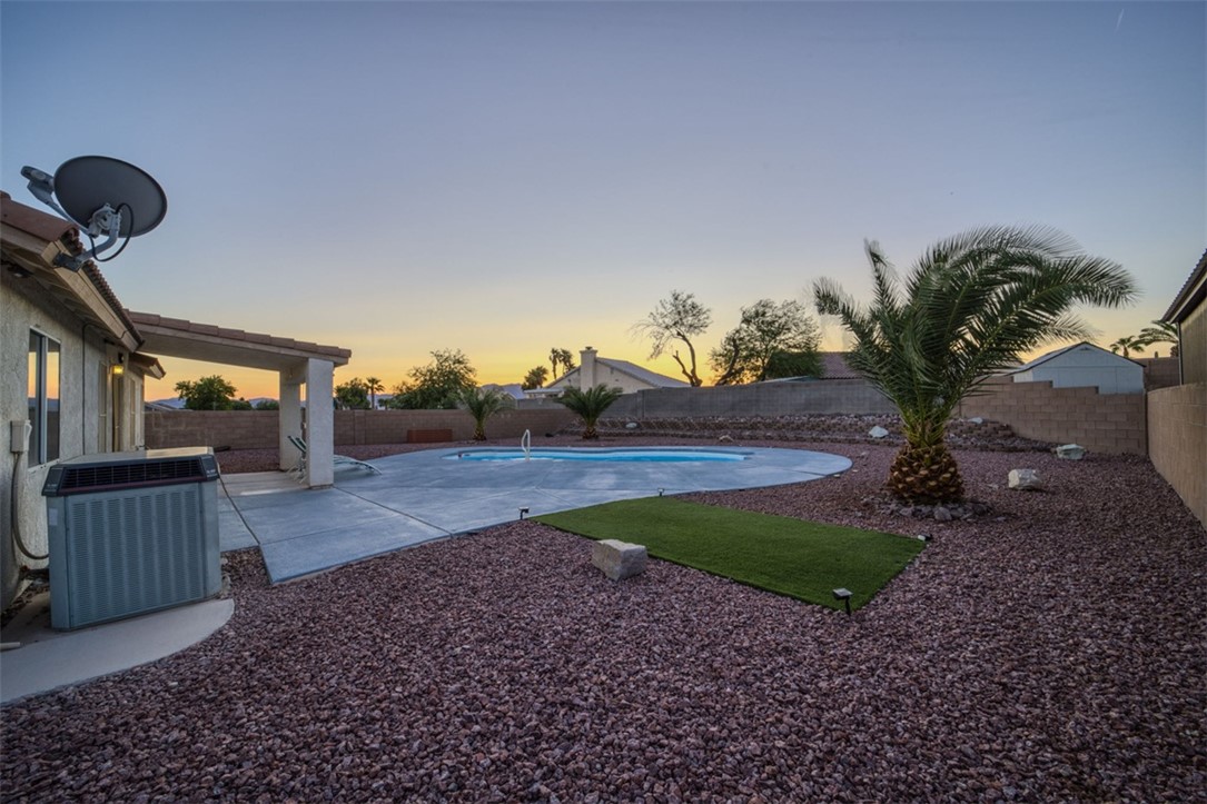 2213 Jamie Road Fort Mohave, AZ 86426 - Photo 44 of 51 Pool at dusk with a patio and a fenced backyard