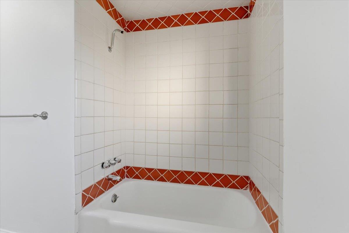 1610 Soto Street Seaside, CA 93955 - Photo 15 of 20 a bathroom with a bathtub and a shower