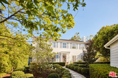a view of a house with a tree