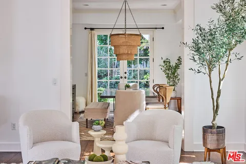 a kitchen with stainless steel appliances a sink stove and cabinets