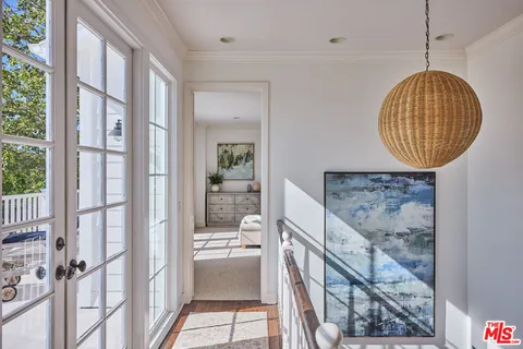 a view of a living room with a large window