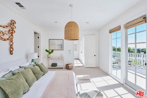 a bathroom with a sink a mirror and a window