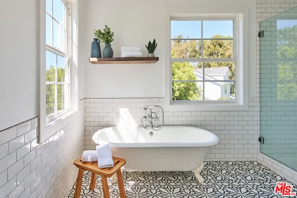 a bedroom with bed and window