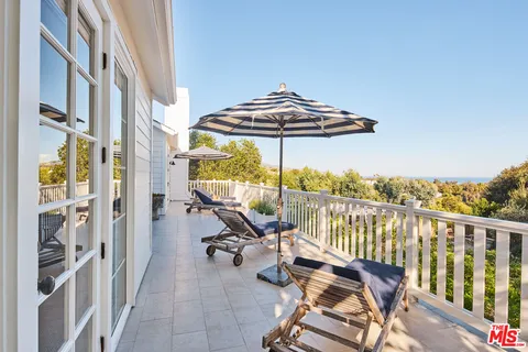 a bedroom with bed and a window