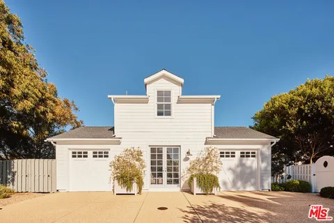 a view of a wooden fence and trees