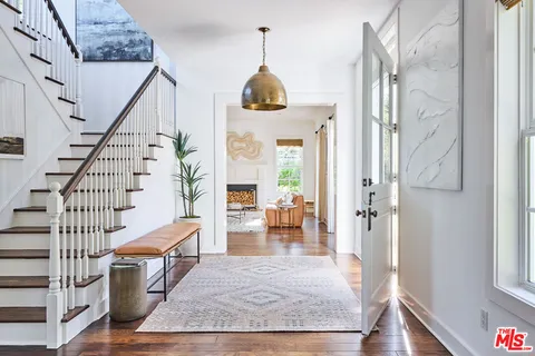 a view of an entryway with wooden floor