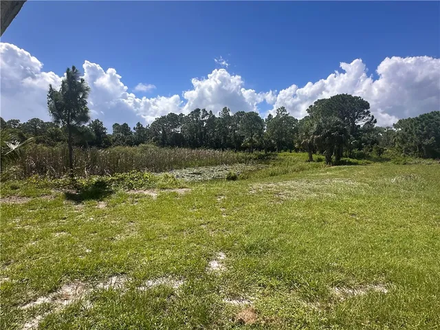 a patio with a table and chairs