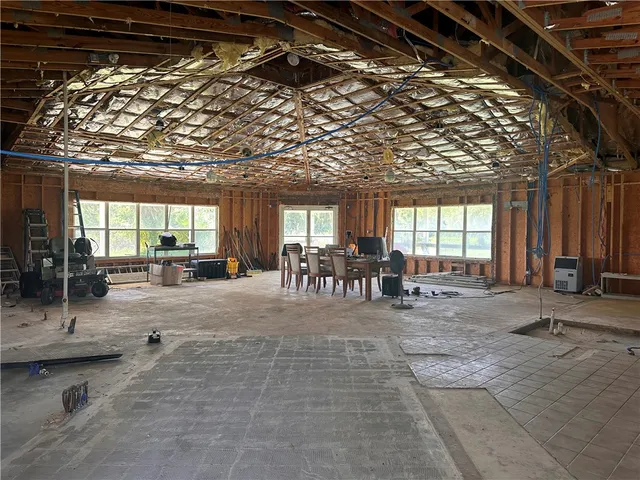 a view of gym with large trees