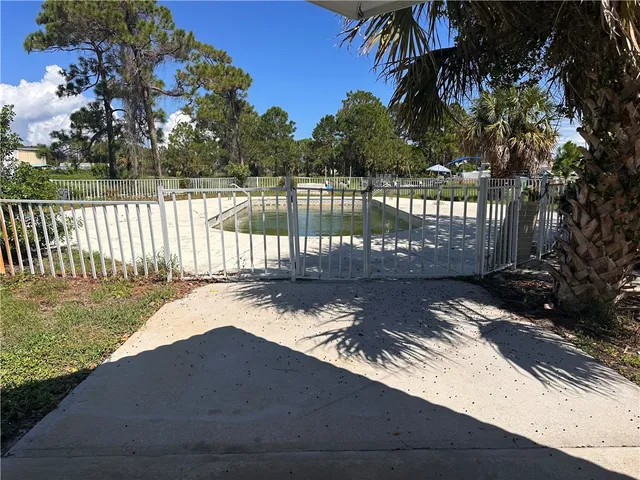 a view of a backyard with palm tree