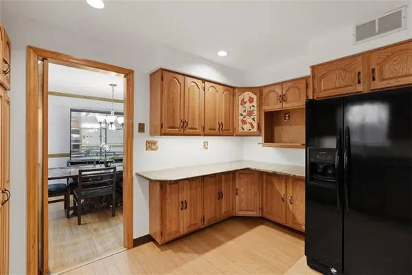 a kitchen with a sink cabinets and appliances