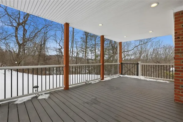 a view of deck with wooden floor and fence
