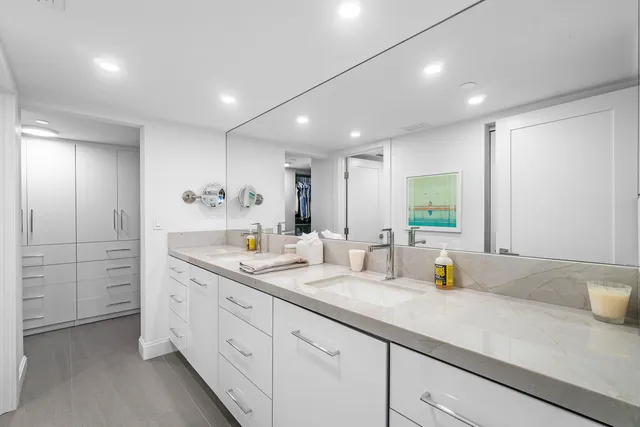 a bathroom with a toilet sink and shower