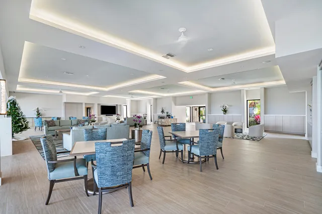 a view of swimming pool with seating space