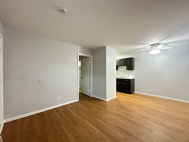 a view of empty room with a fireplace