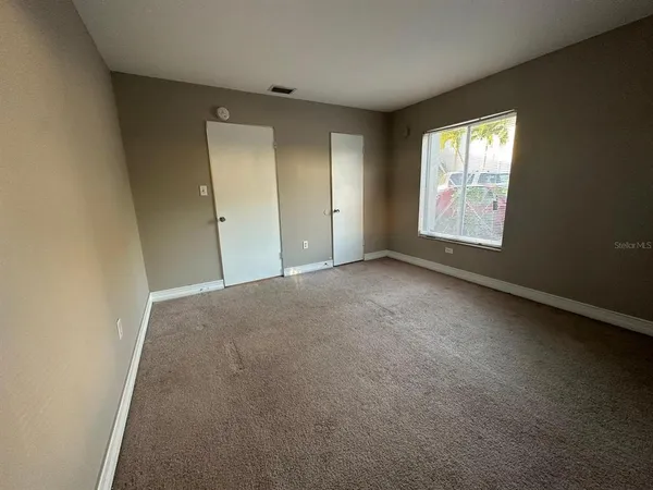 a view of an empty room and window