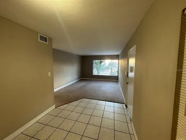 a view of an empty room and window
