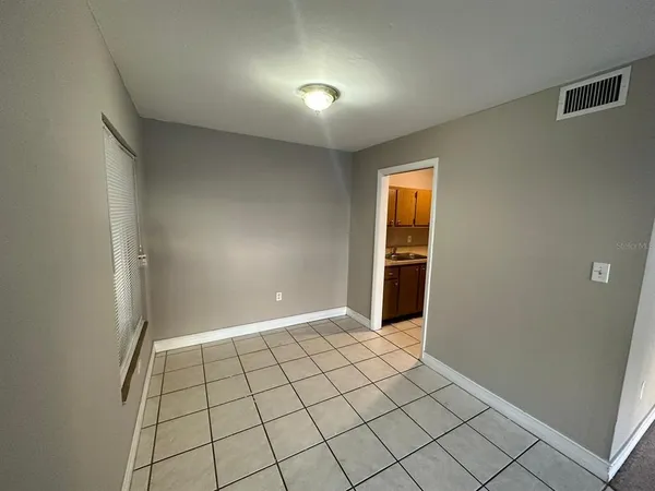 a view of an empty room and window