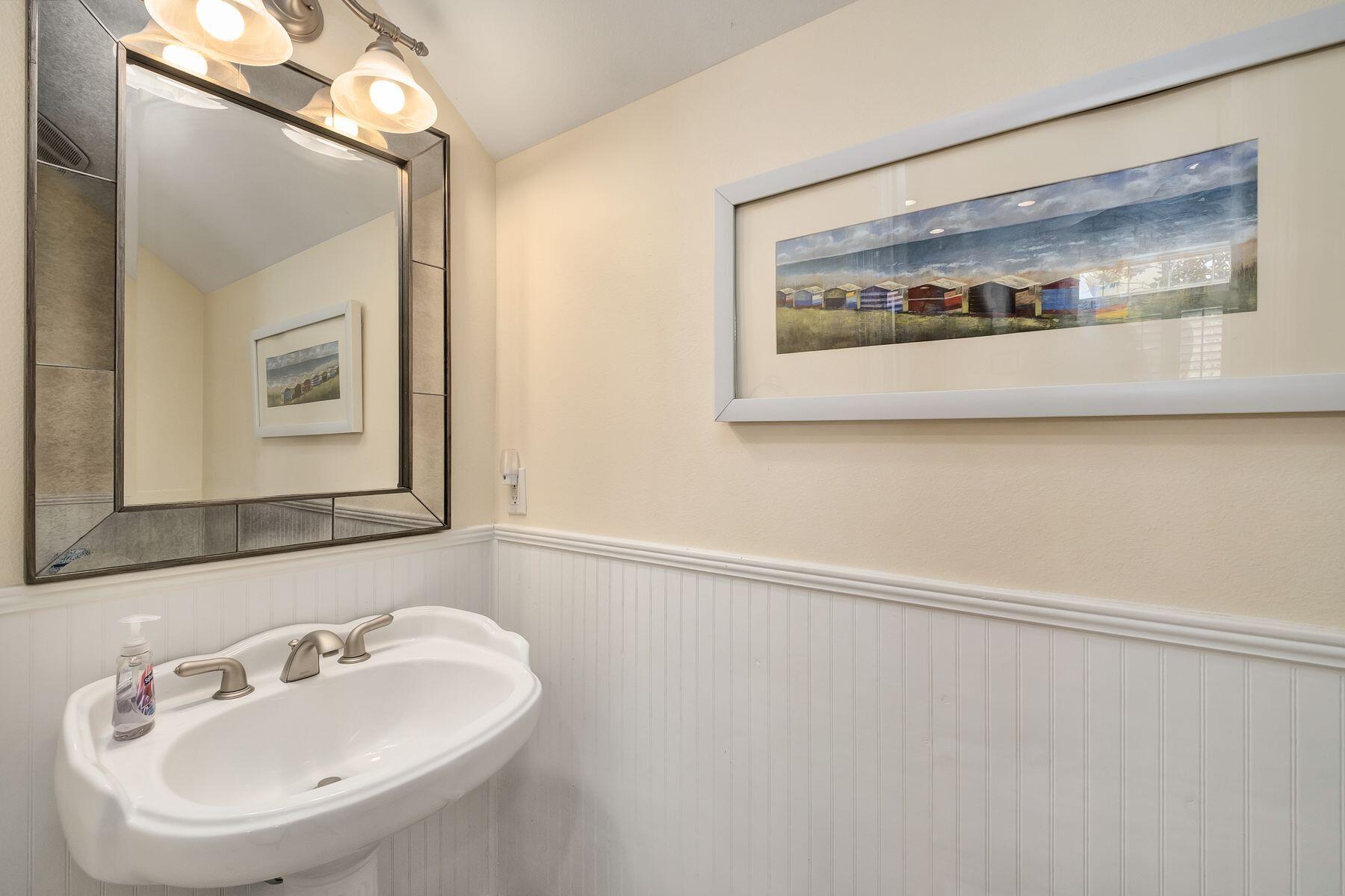 352 Cassine Garden Circle Santa Rosa Beach, FL 32459 - Photo 13 of 43 a bathroom with a sink and mirror