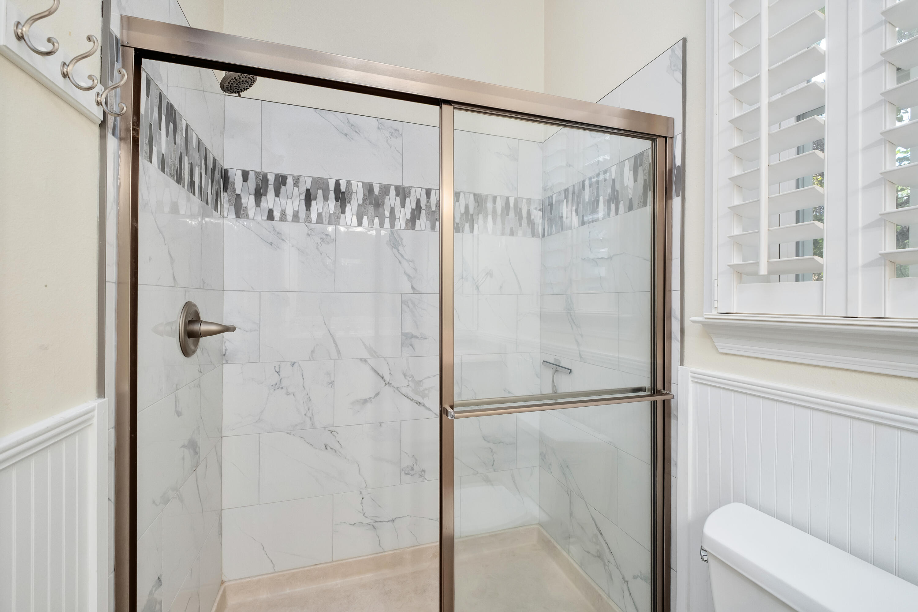 352 Cassine Garden Circle Santa Rosa Beach, FL 32459 - Photo 17 of 43 a bathroom with a glass shower door