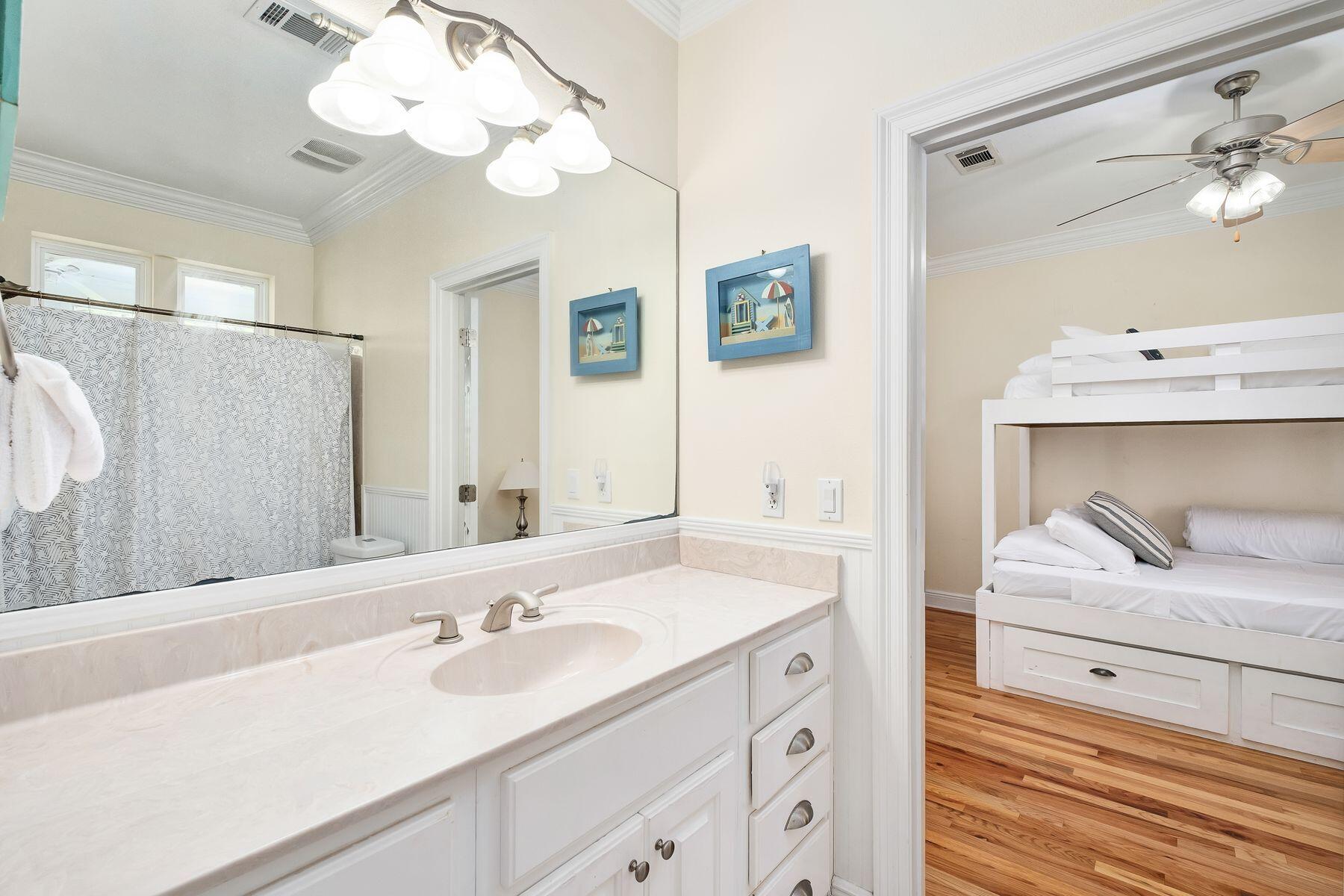 352 Cassine Garden Circle Santa Rosa Beach, FL 32459 - Photo 28 of 43 a bathroom with a sink a mirror and a shower